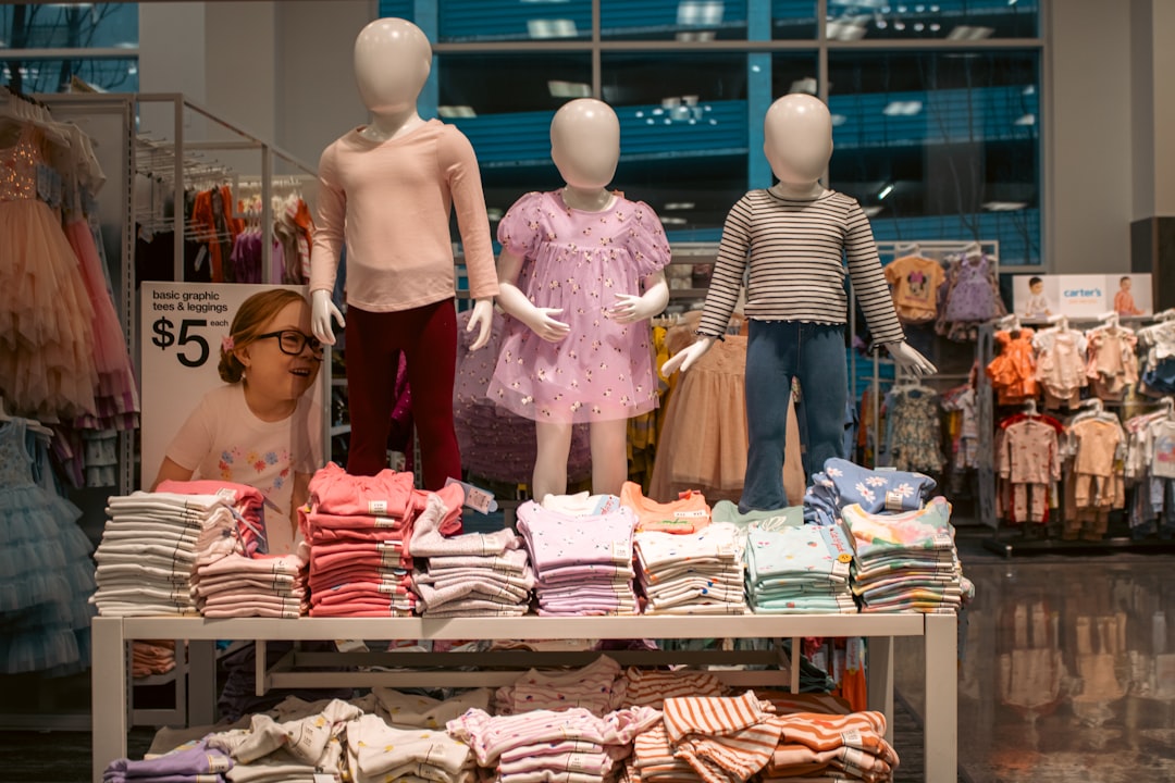 Three child-sized mannequins are prominently displayed, showcasing various outfits at Target Downtown Seattle.